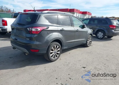 2017 Ford Escape Titanium z USA, uszkodzony, nr VIN 1FMCU0JD0HUC44640